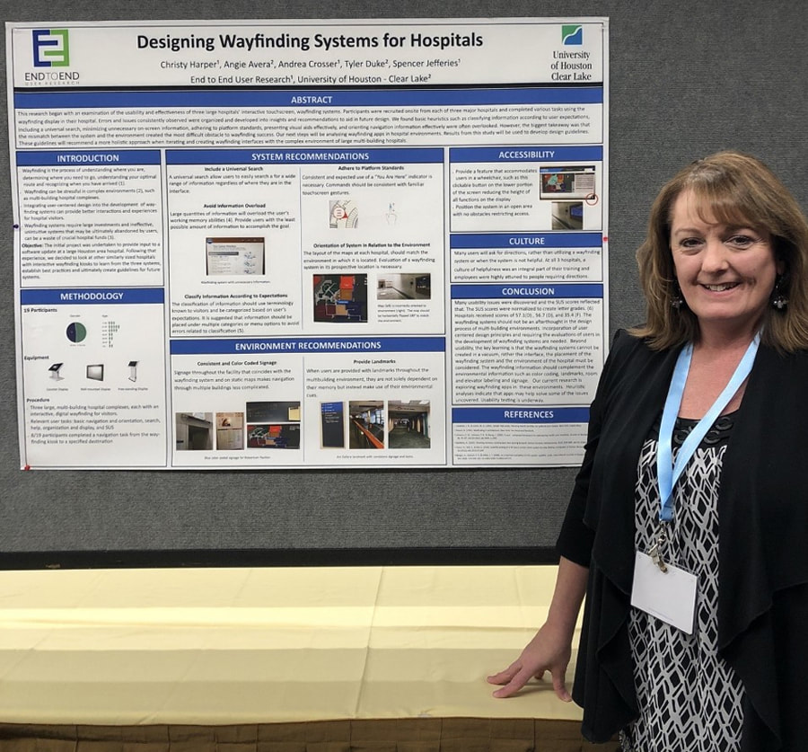 Christy Harper stands with her research poster at the University of Houston Clear Lake.